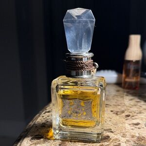 Juicy Couture perfume Parfum 1.7 ounces. Elegant Crystal-Top Perfume Bottle